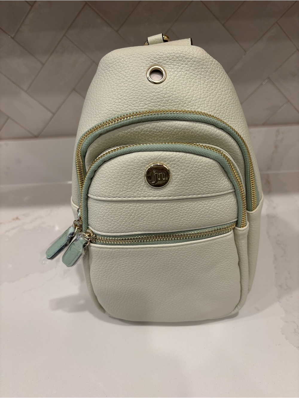 NWT Jessica Moore Sling Bag in bone/mint green